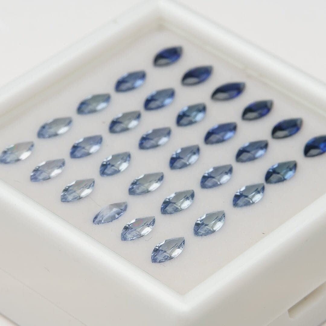 Set of 30 synthetic lab-produced marquise tanzanite gemstones, 3x6mm, blue