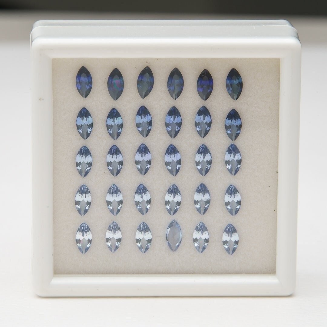 Set of 30 synthetic lab-produced marquise tanzanite gemstones, 3x6mm, blue