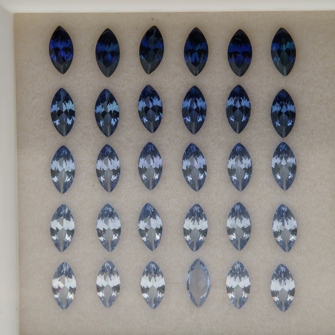 Set of 30 synthetic lab-produced marquise tanzanite gemstones, 3x6mm, blue